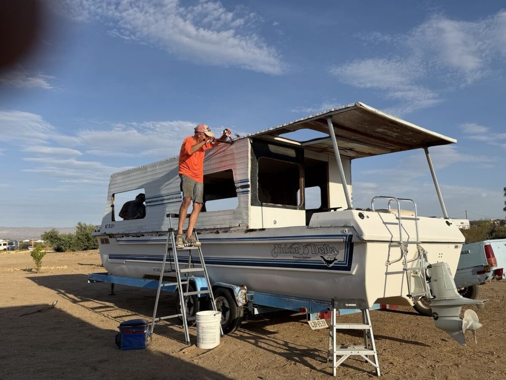 Workers removing the original cabin from the Yukon Delta Nomad