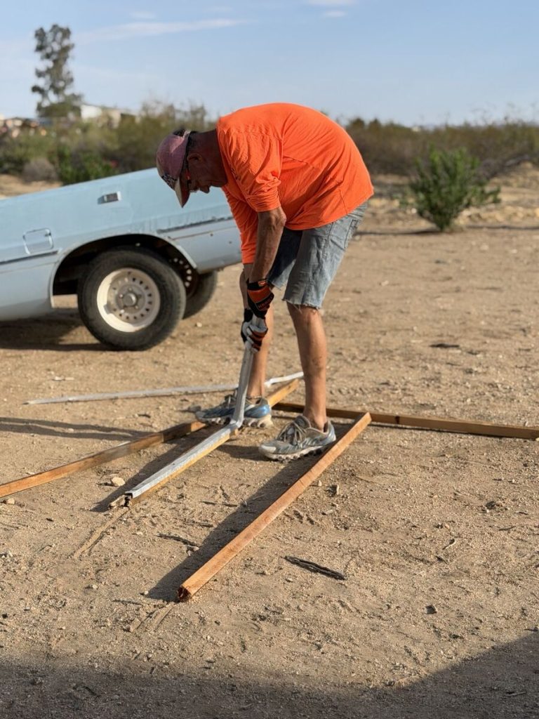 Cutting salvaged aluminum cabin framing for disposal